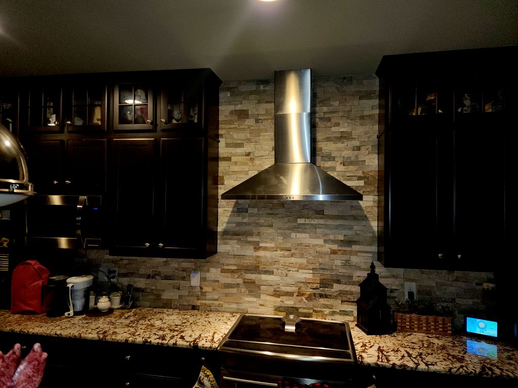 Installed beautiful back splash and hood.