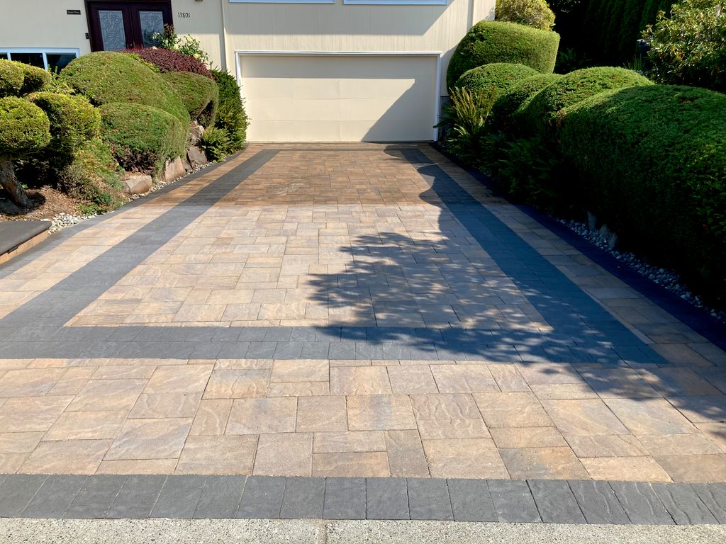 Driveway pavers mid-sealant application.