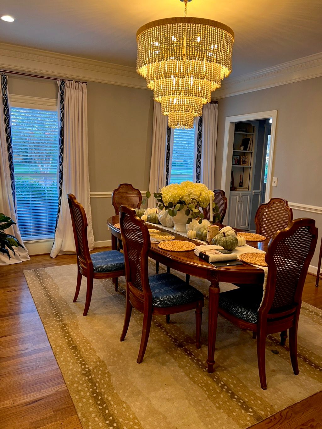 Chris installed a chandelier in our dining room an