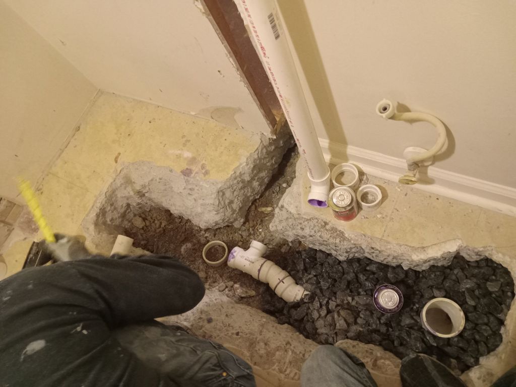 Shower start by installing new drain in floor.