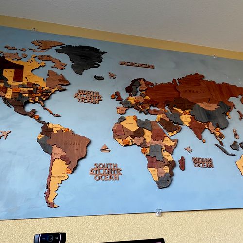 We hired Vince to mount a large world map (80” by 