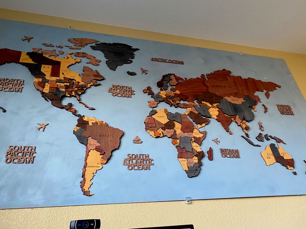 We hired Vince to mount a large world map (80” by 