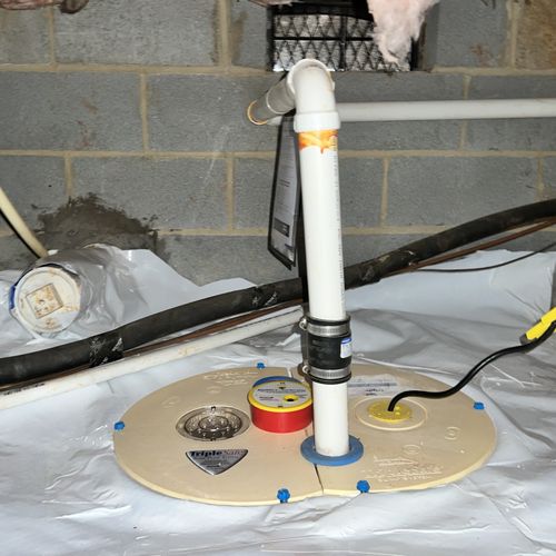 TripleSafe Sump Pump with discharge line leading t