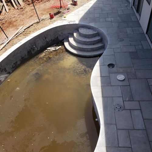 pool with blue stone on concrete for better durabi