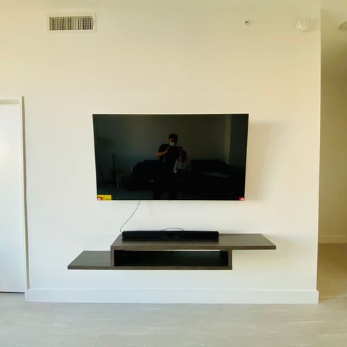 TV mounting with floating stand.