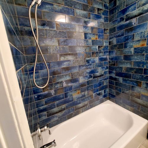 Carlos installed new shower and floor tile in my b