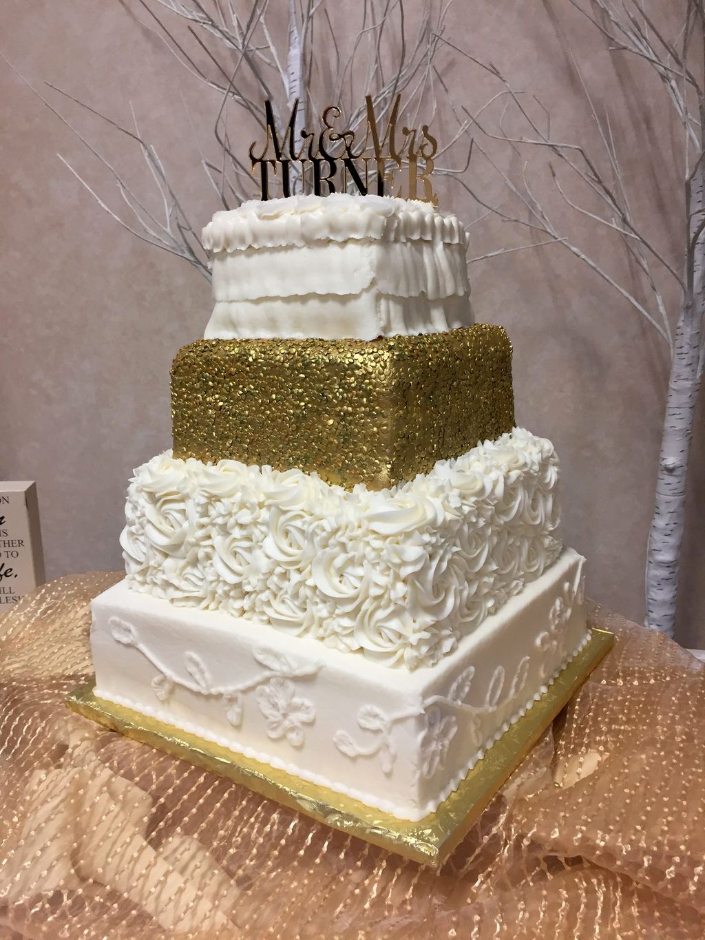 Four-tier square fondant and buttercream Cake by A