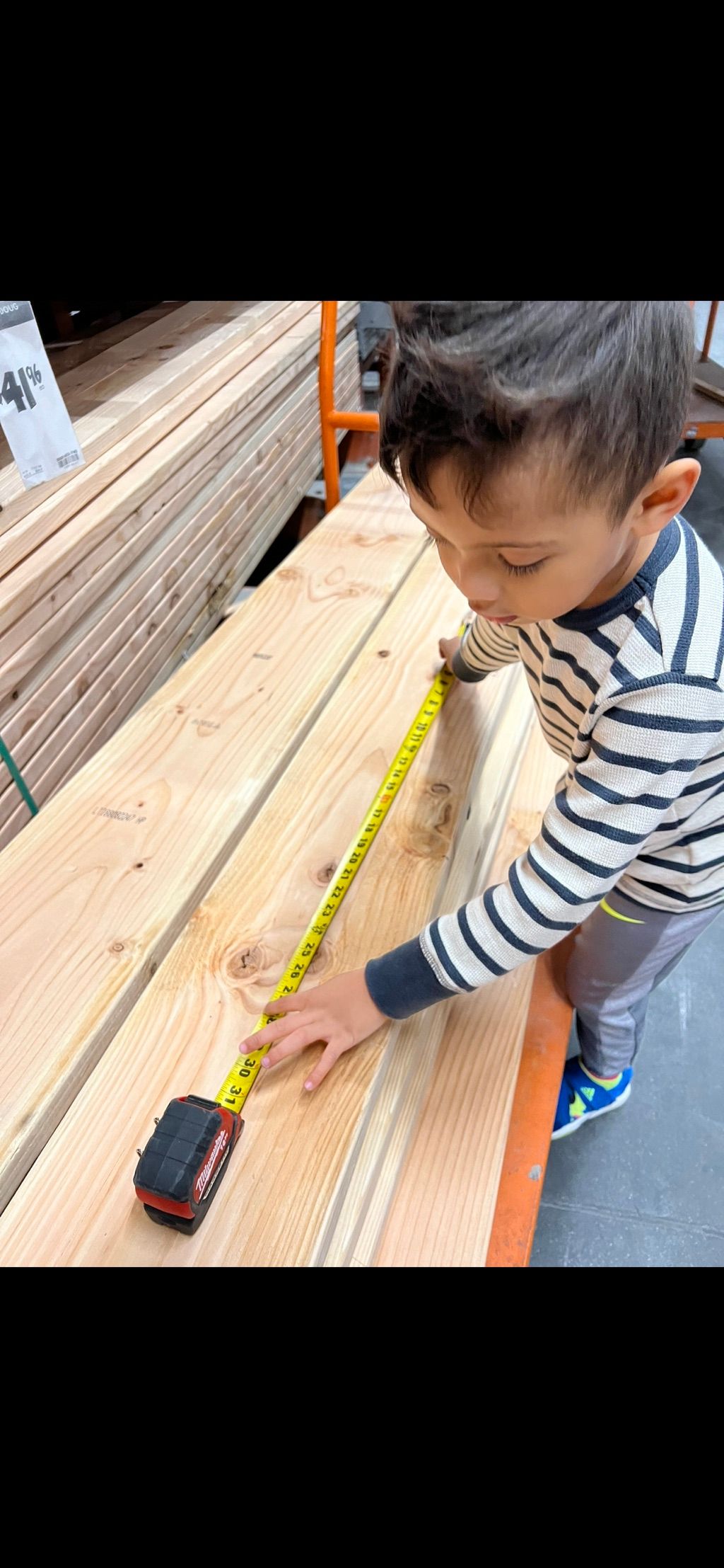 Little Tye our COO making sure all measurements ar