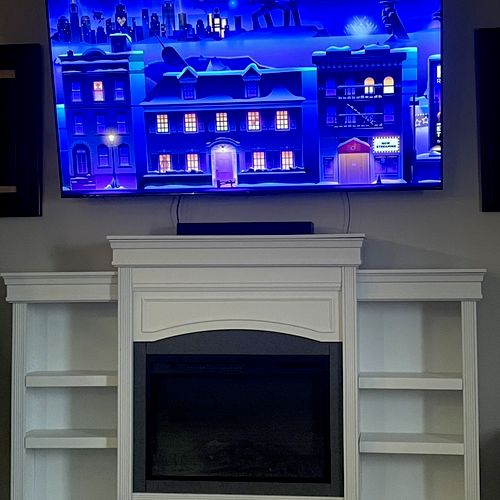 Assembled fireplace entertainment center and mount