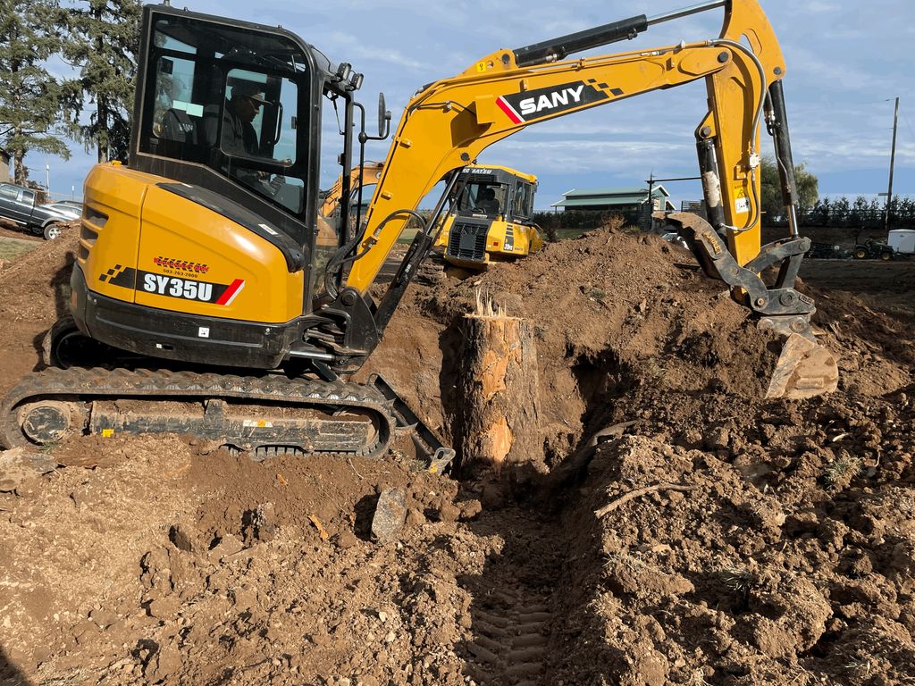 Removing a large stump.