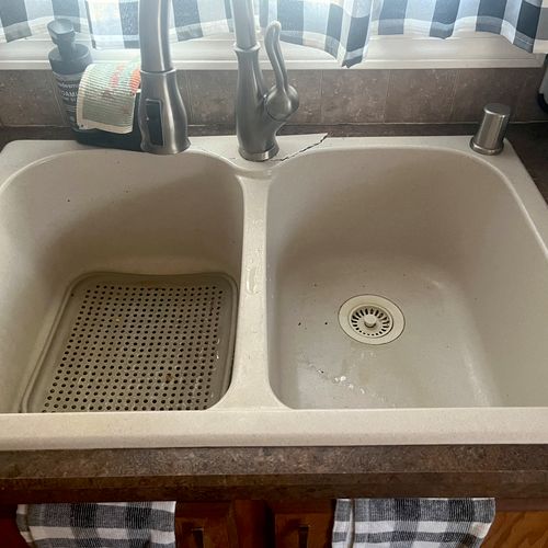 Removed our old broken kitchen sink and installed 