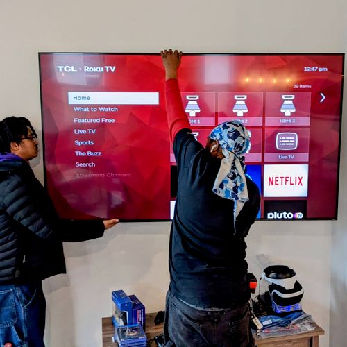 Derrick and his assistant mounted a new 75" TCL Ro