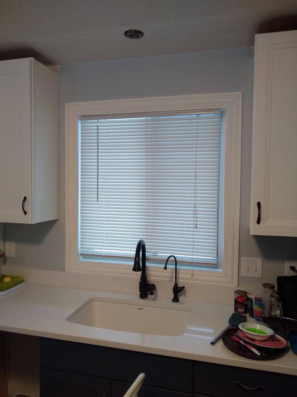 Installed trim around window, including height cut