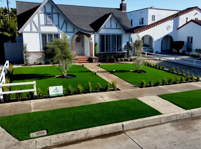 low-maintenance front yard curb appeal idea: artificial grass