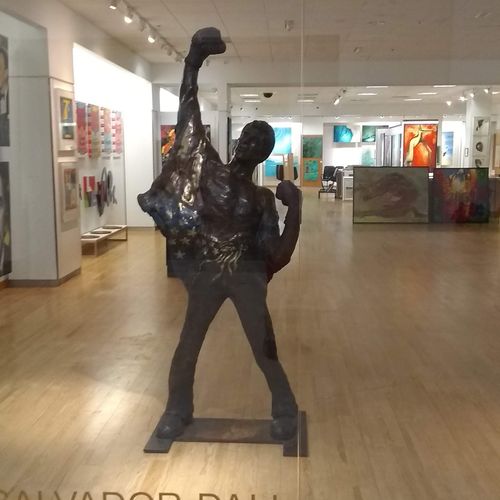 Heavy bronze statue moved into a gallery