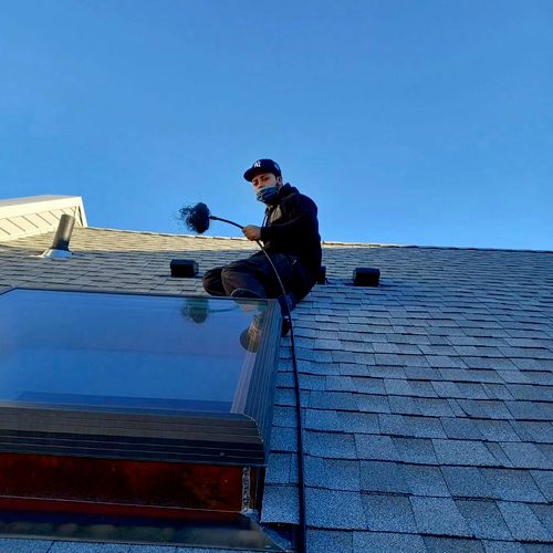 Dryer vent cleaning on roof