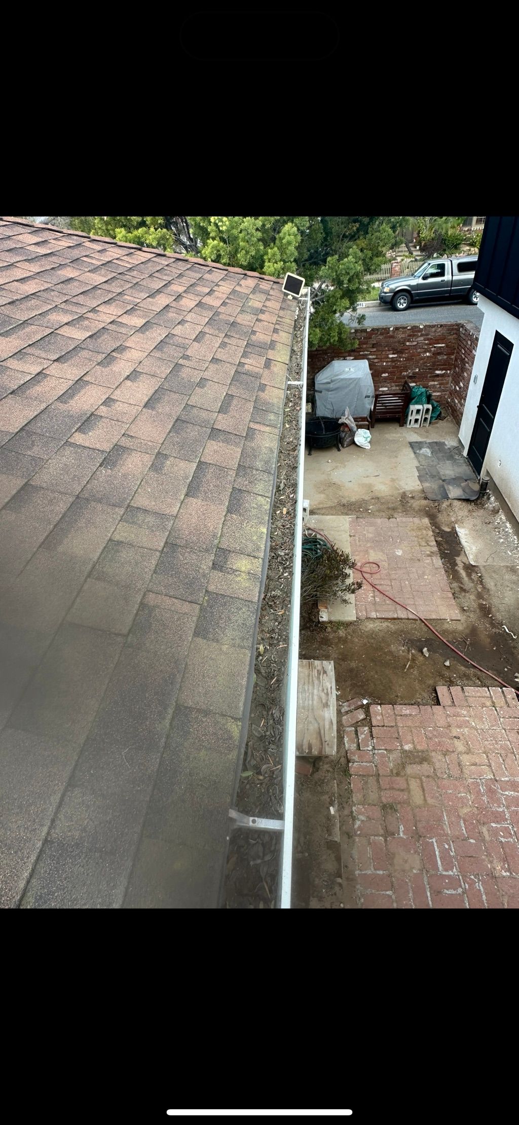 Before gutter and moss cleaning 