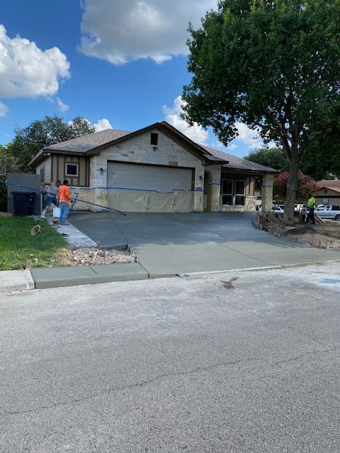 driveway with city sidewalk and approach