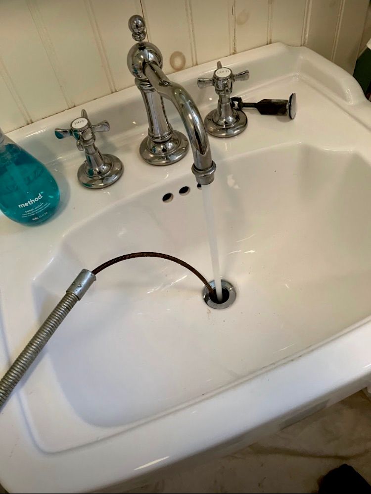 Snaking of a sink drain with a pedestal 