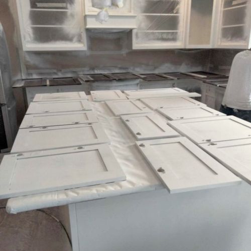 We are cabinet painting specialists!  Why buy new 