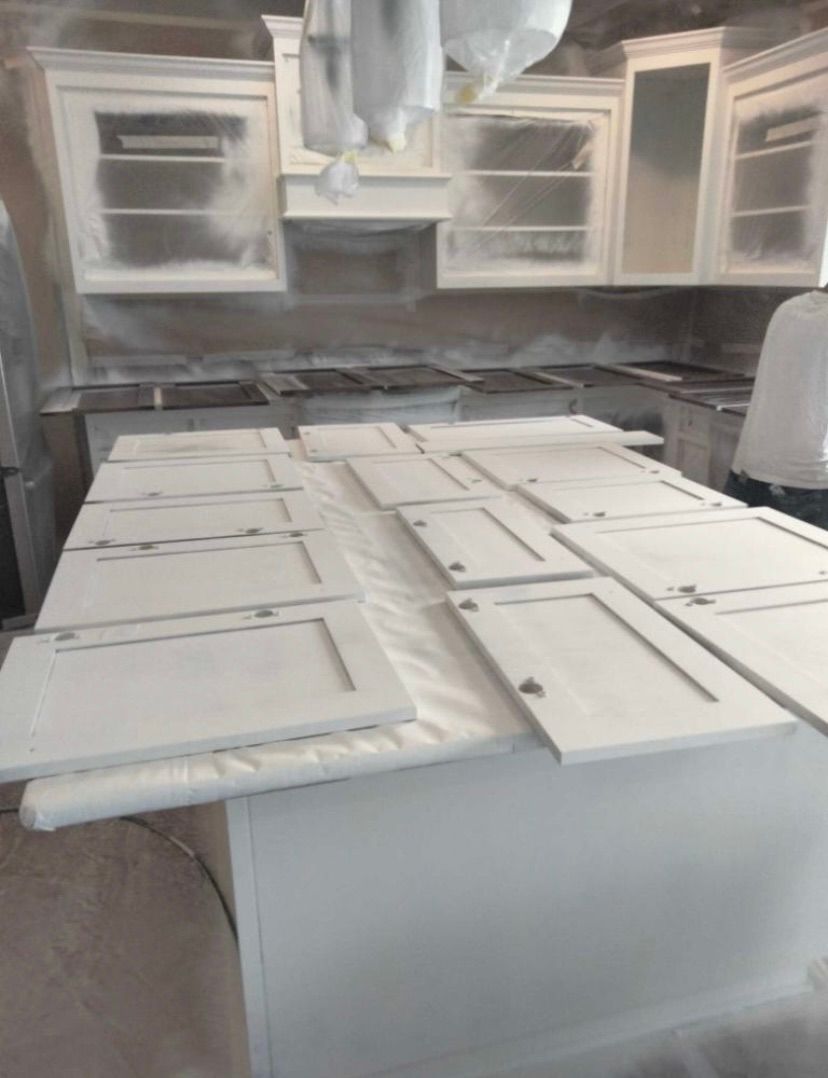 We are cabinet painting specialists!  Why buy new 