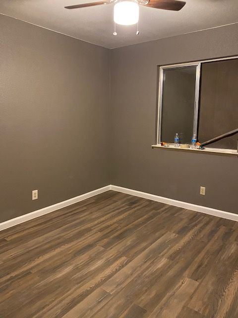 Interior paint, baseboards, and laminate flooring
