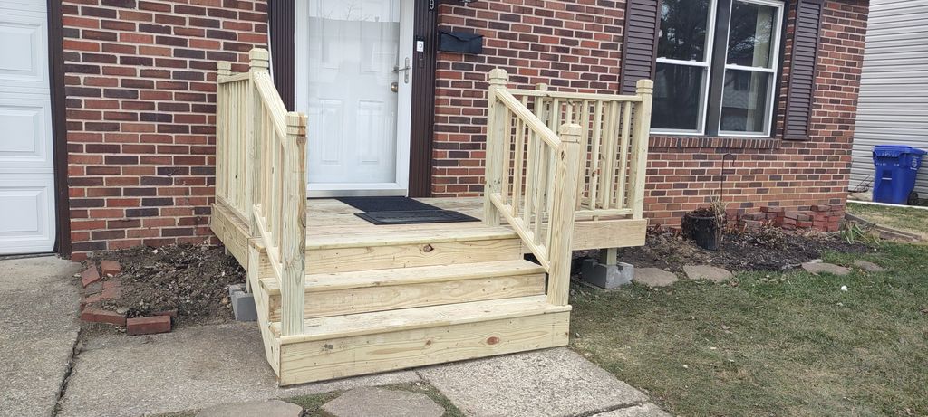 Wooden porch built over a crumbling concrete porch