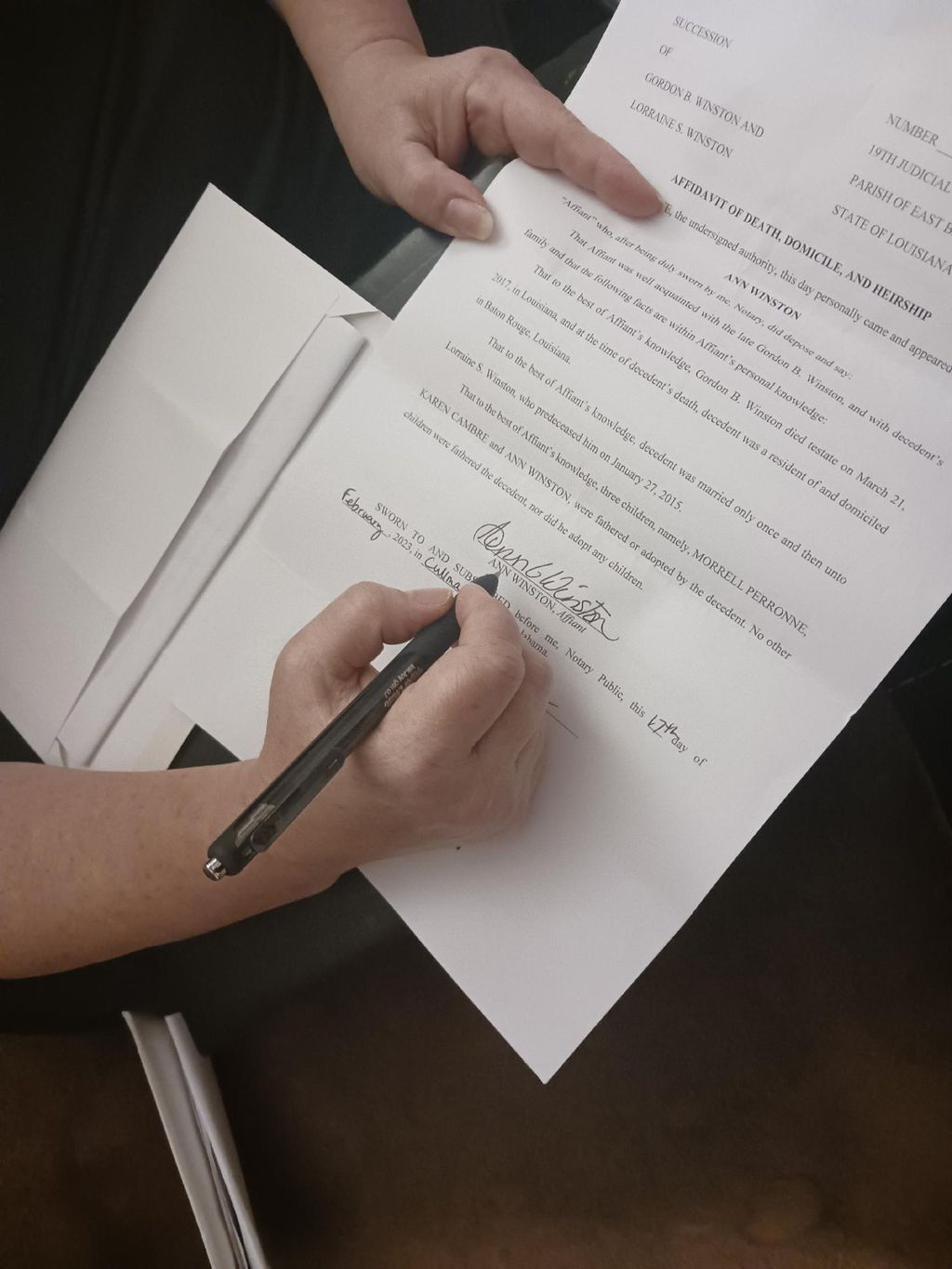 Ms. Ann signed her documents