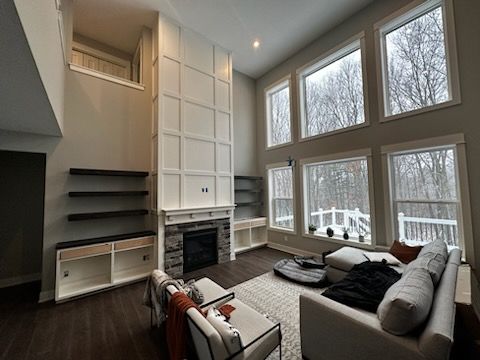 Built-ins with floating shelves; fireplace accent 