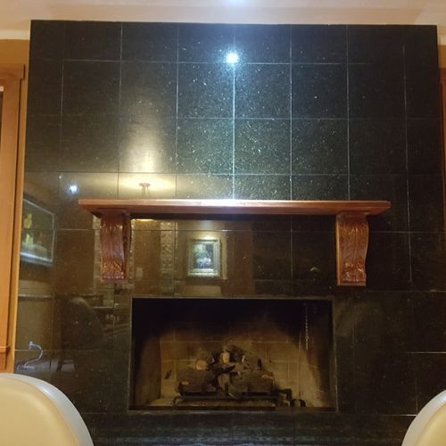 Finished granite tile fireplace