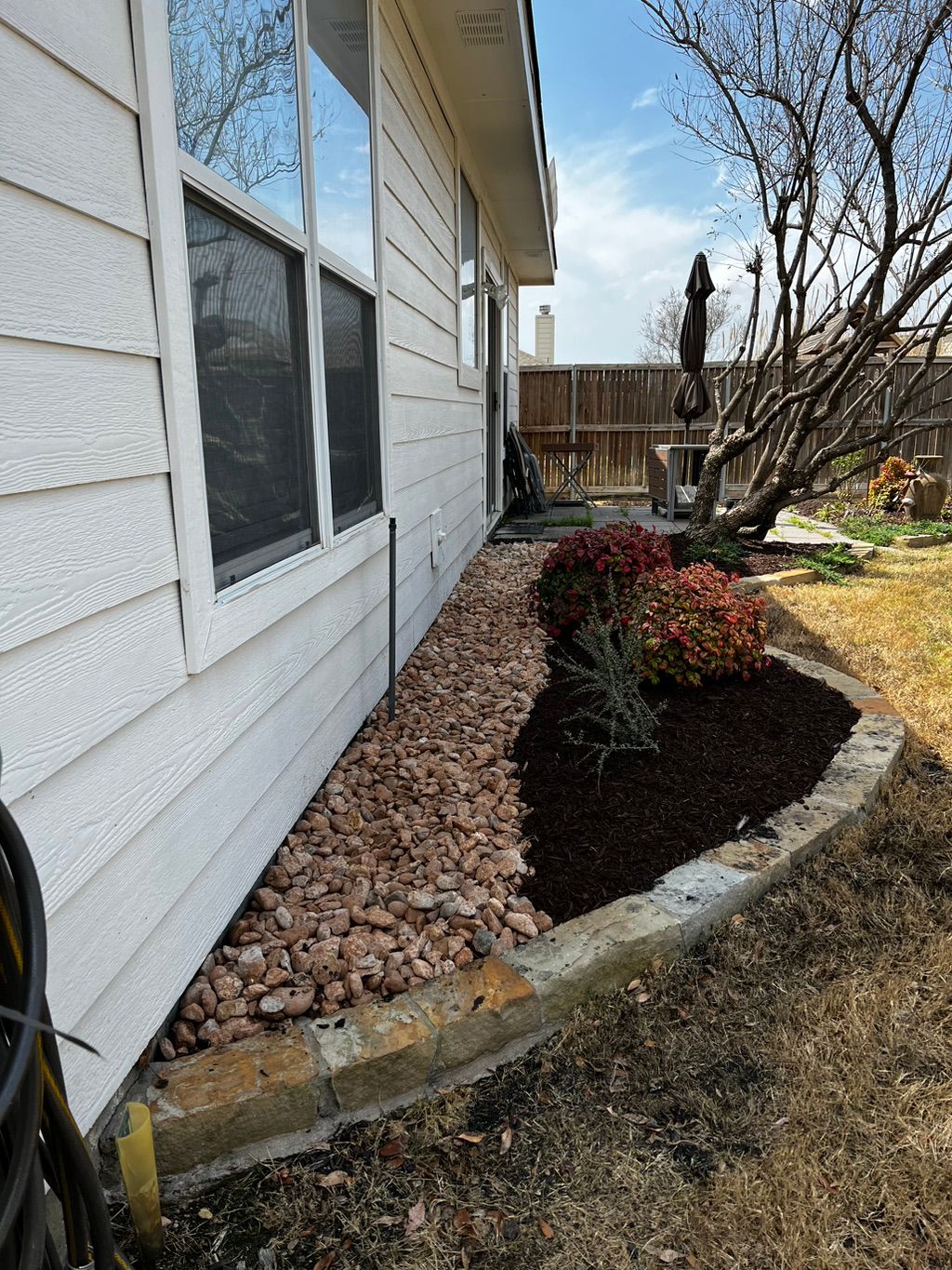River rock bed in the back to mitigate mud and was
