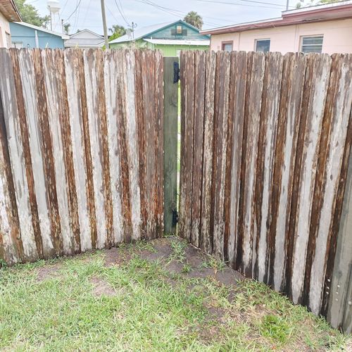 Pressure washing fence before.