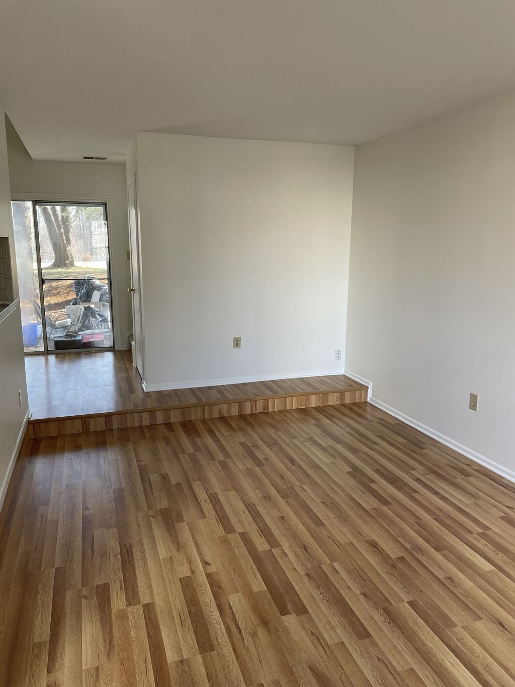Damaged walls and new flooring: After 