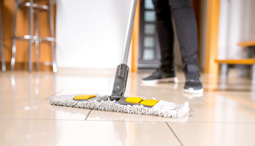 mopping and cleaning tile floors