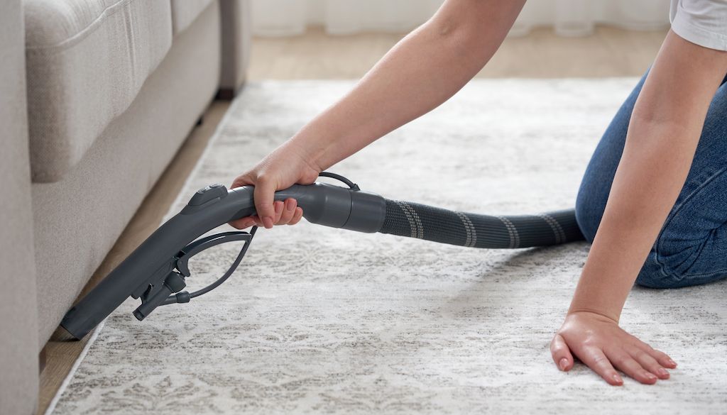 vacuuming under the couch