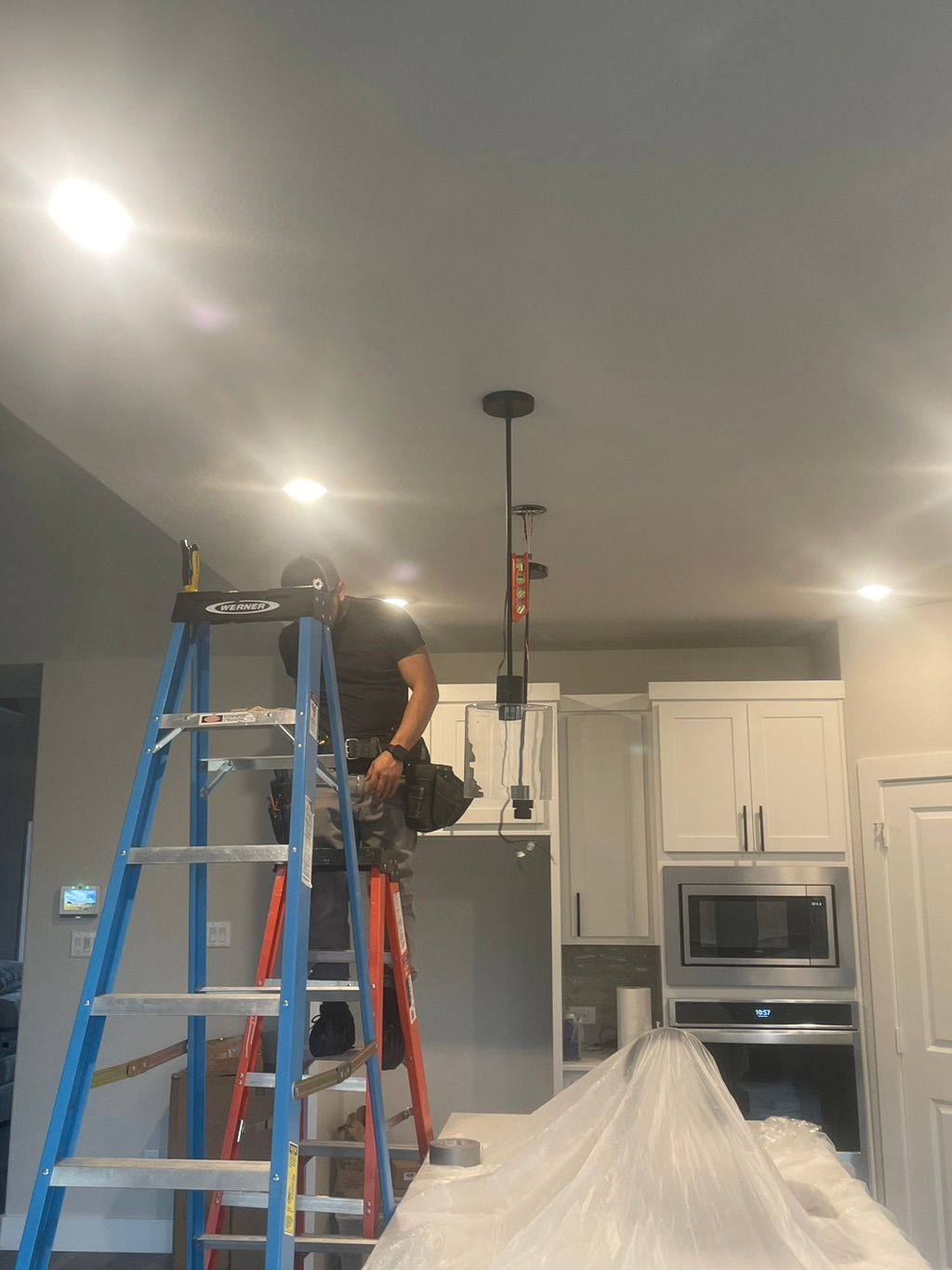 Pendant lighting, using level to make sure install