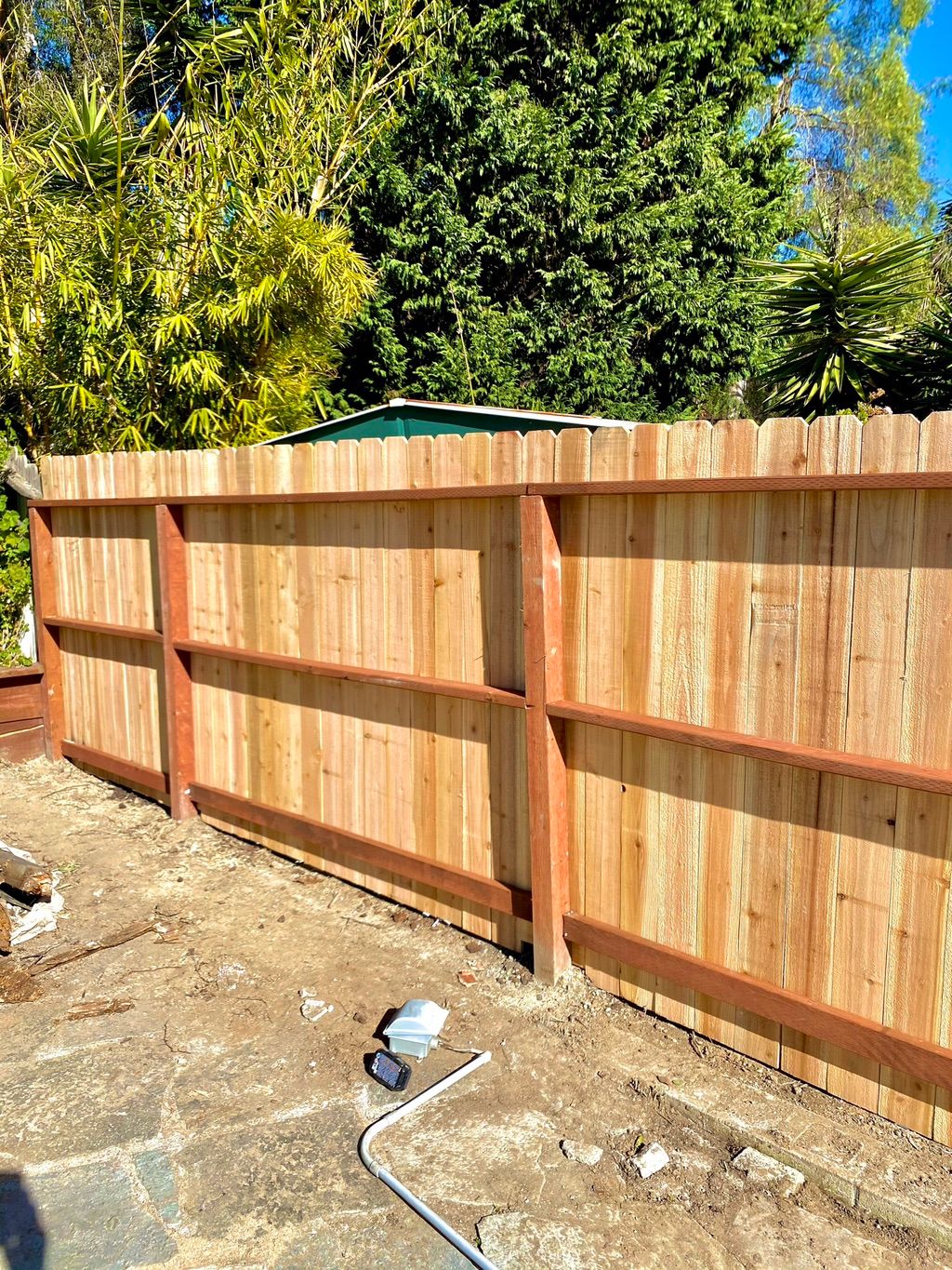 Dog eared wood fence build.