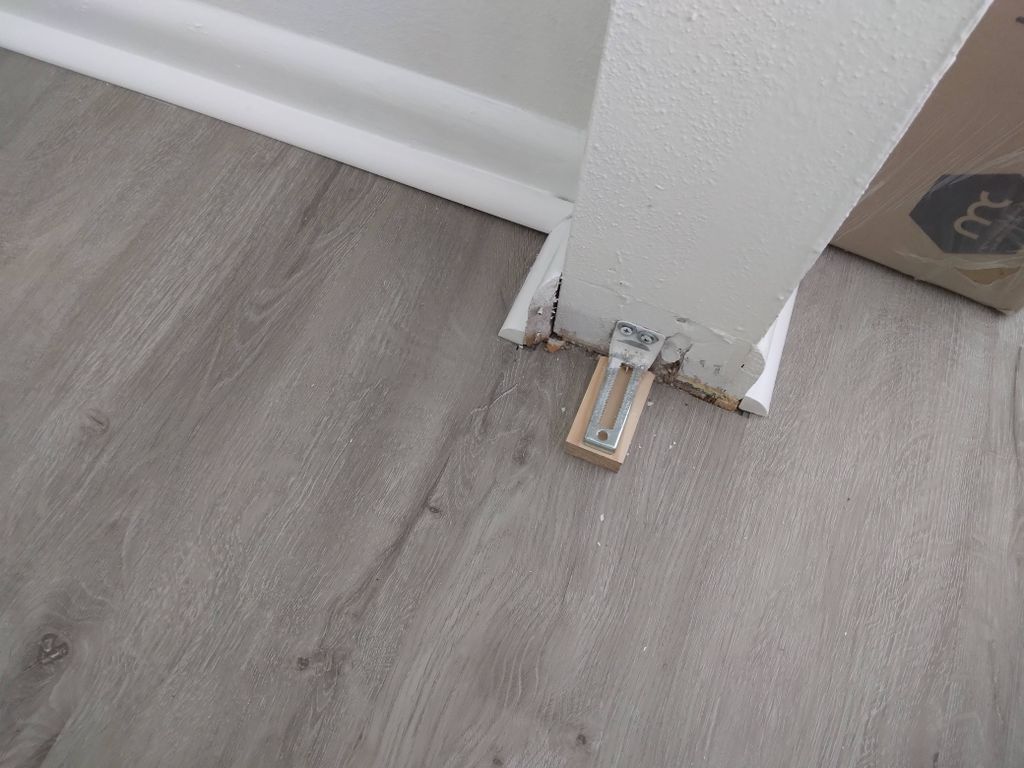 sliding closet door base adjusted