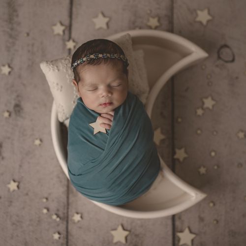 Newborn portrait session with moon props 
