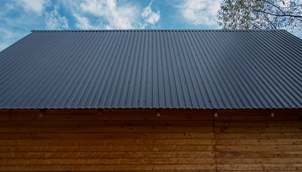 dark tin roof on wooden house