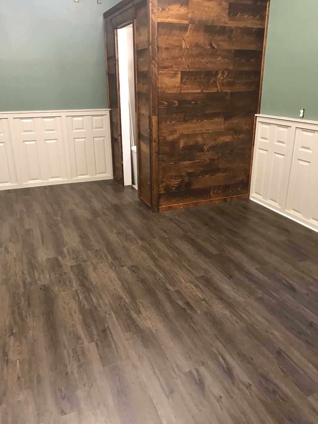 Luxury Vinyl Planking with custom wood pantry