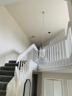 handrail painted & new modern chandelier installed