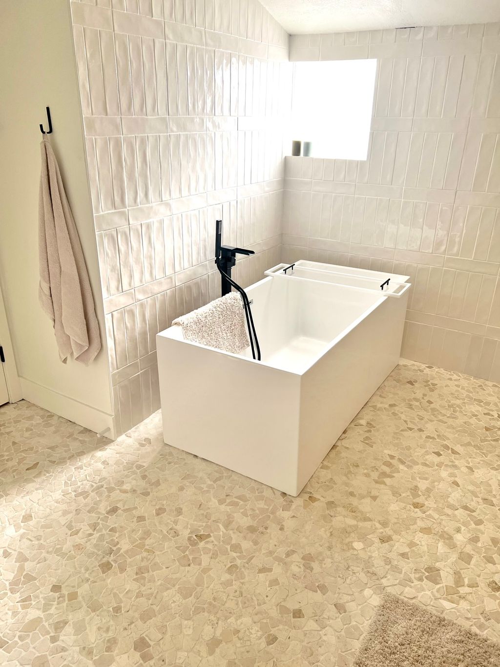 Artisanal subway tiles, pebble flooring, and a new