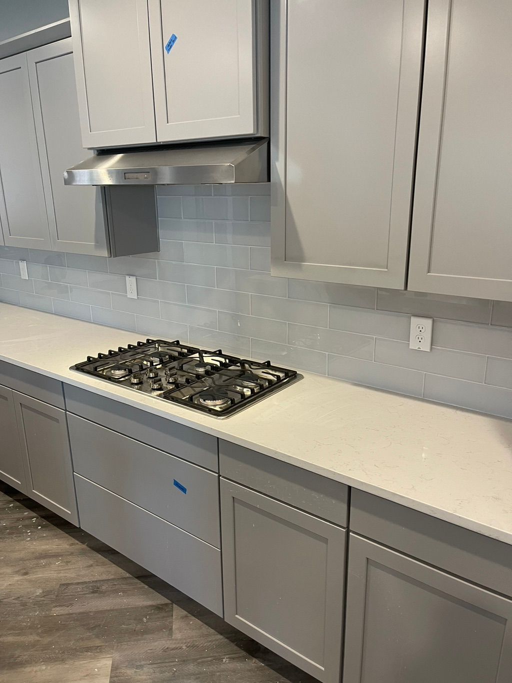 Glass subway tile installation.