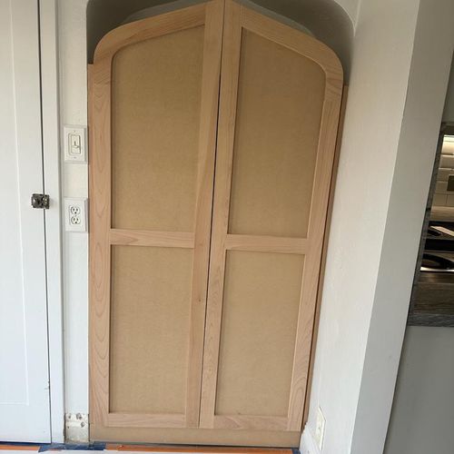 "Sanding, caulking, priming, and painting the door