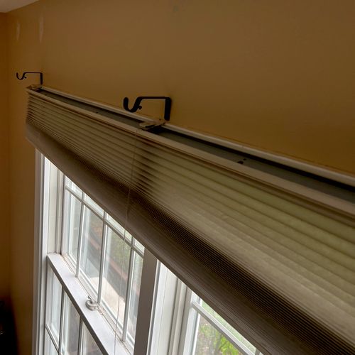 Installing new curtain hangers 
