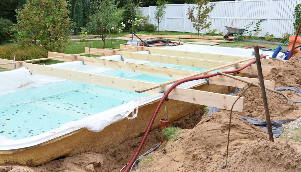 fiberglass pool construction in yard