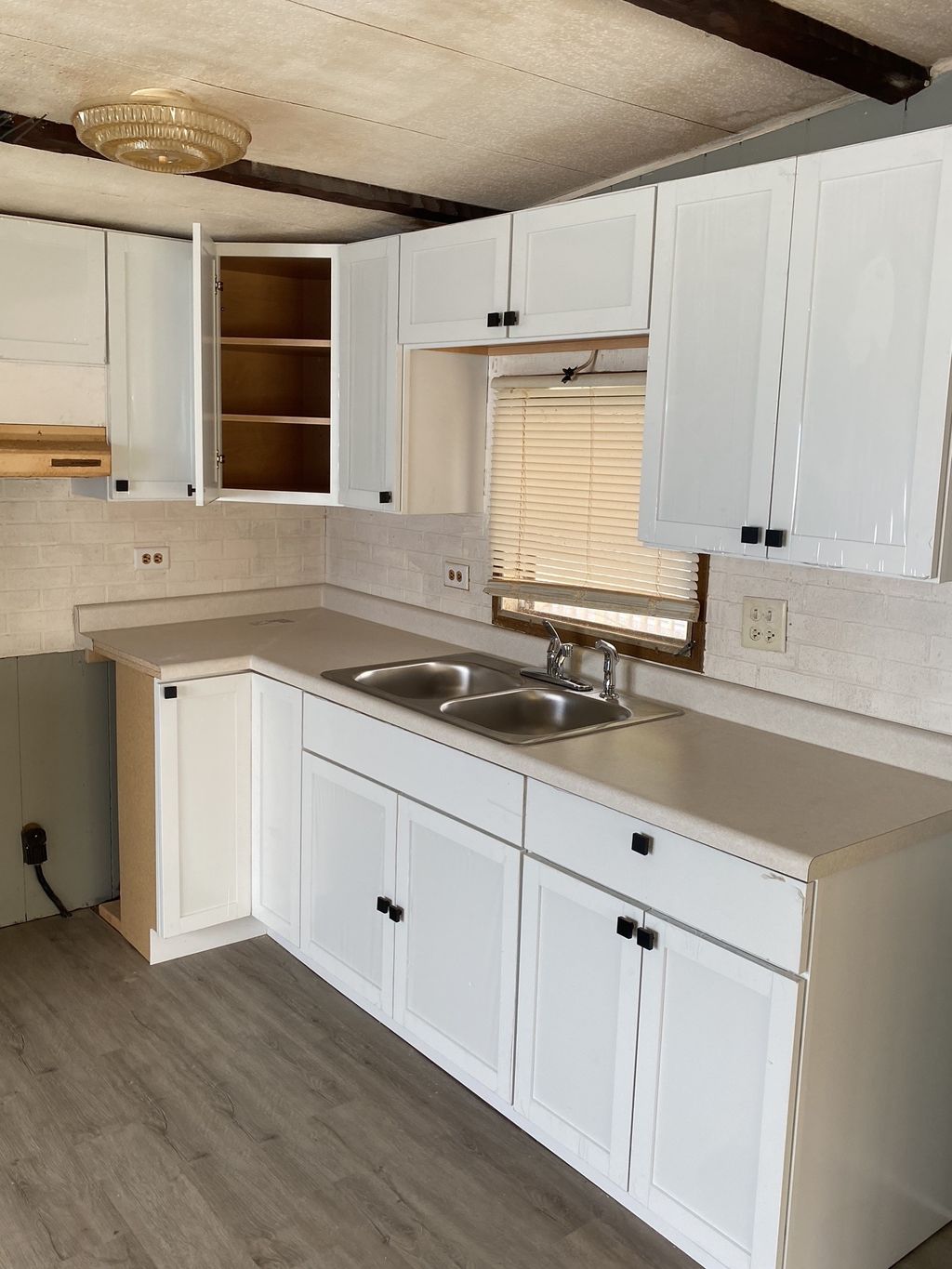 FOUND! Recently Flipped Kitchen concealing damage!