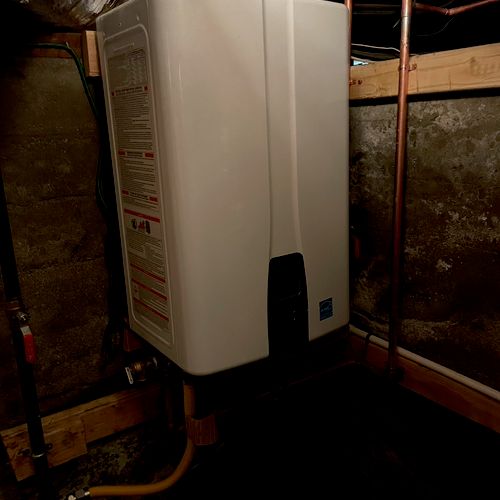 Tankless water heater installed in basement