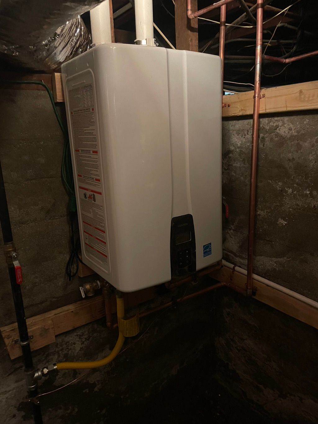 Tankless water heater installed in basement